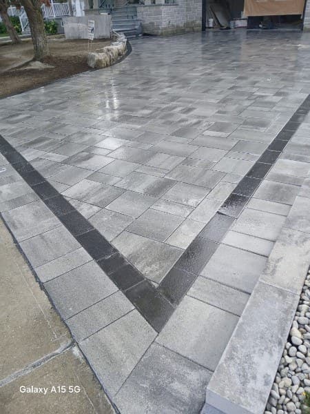 Interlocking stone driveway with dark border detail