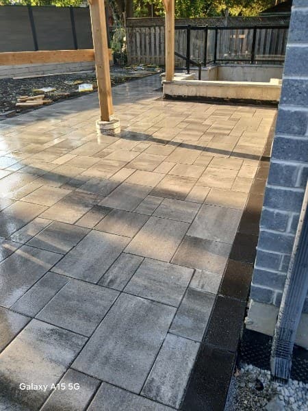 Finished interlocking stone patio with clean borders